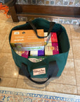 Forest green canvas tote bag with black straps and Colorado Tent logo
