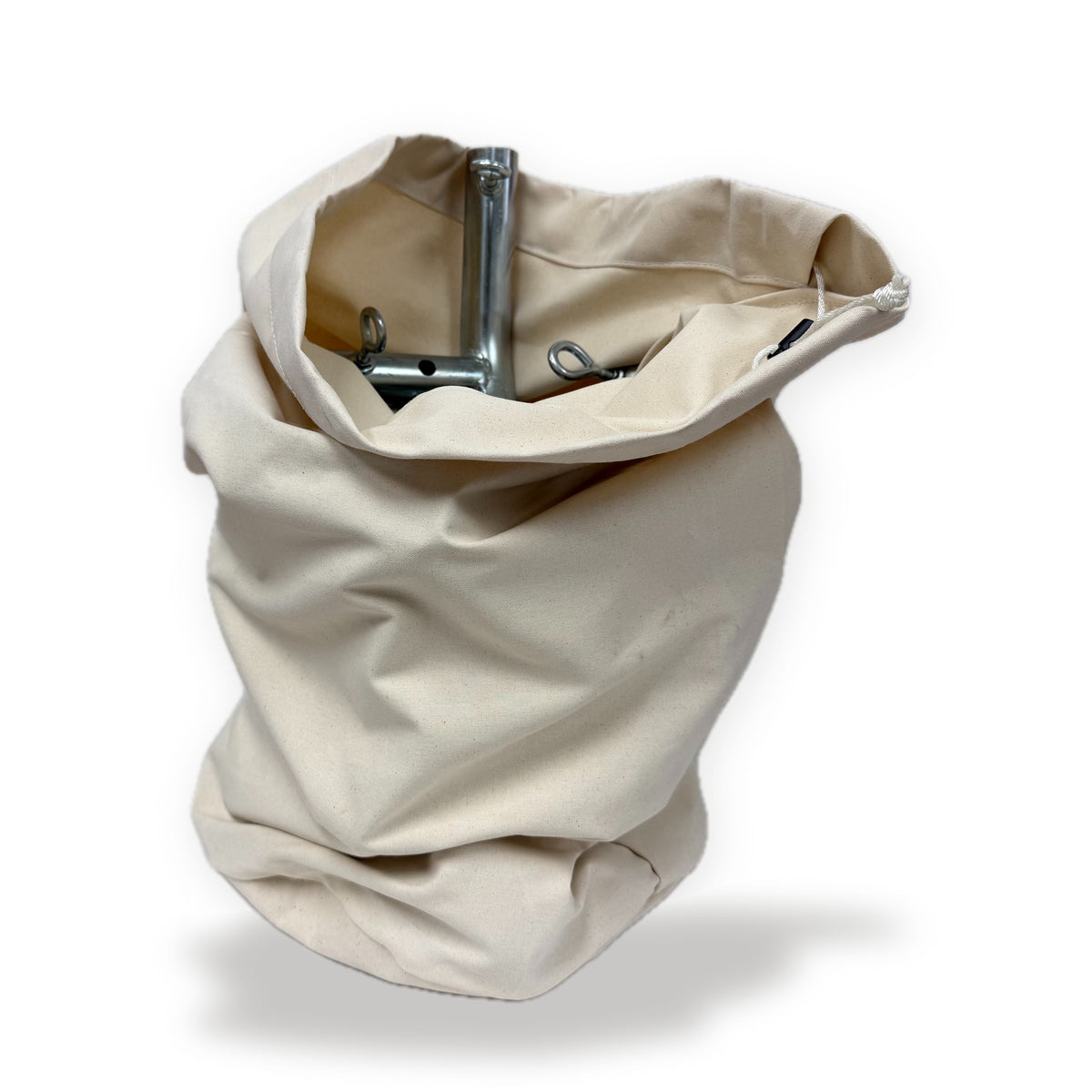 Natural canvas Coupler Bag holding steel tent frame couplers, on a white background