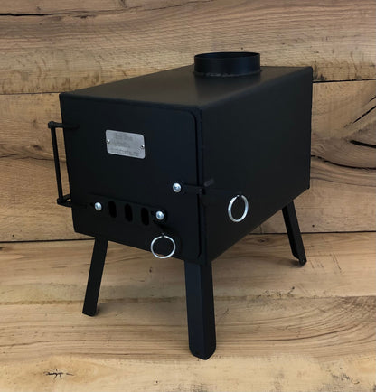 Base Camp Wood Stove by North Woods Fabrication, front three-quarter view