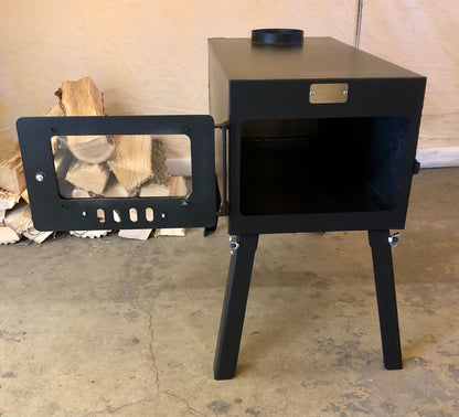 Explorer Wood Stove Kit by North Woods Fabrication, door open to the firebox