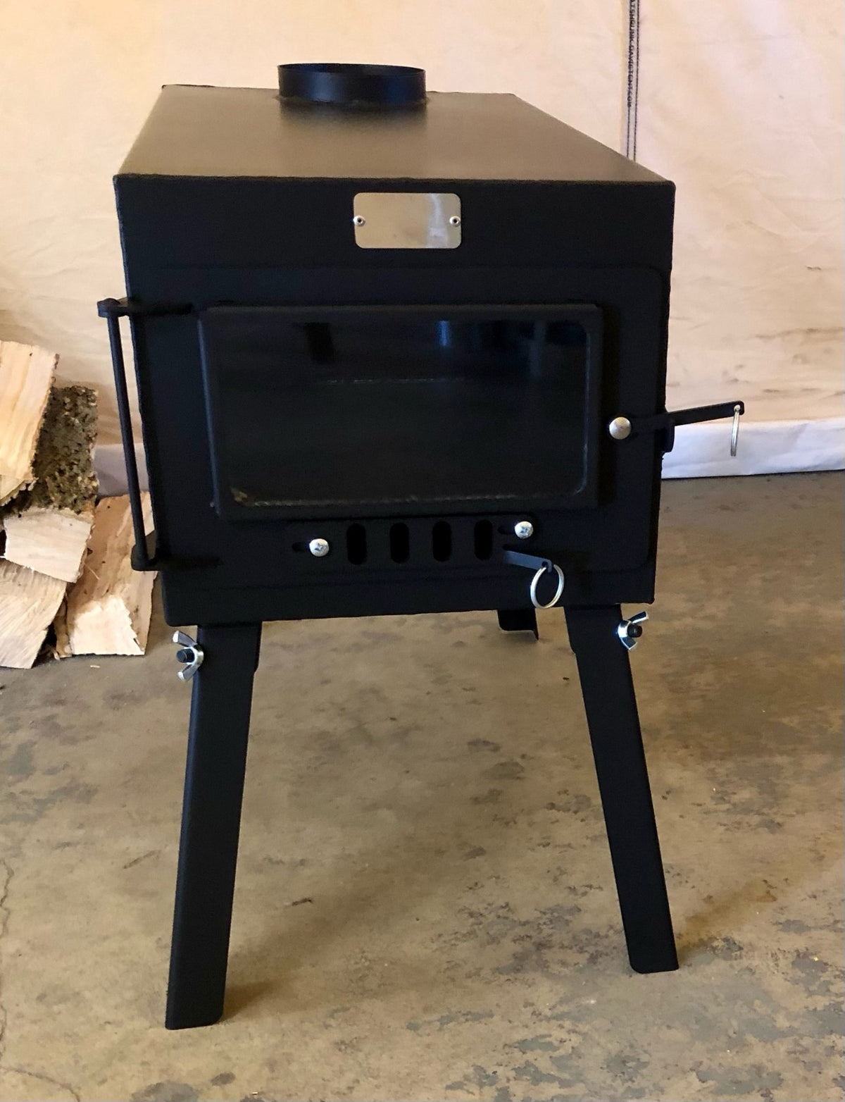 Explorer Wood Stove Kit by North Woods Fabrication, front view with glass door