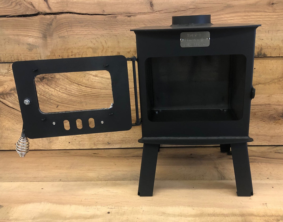 Mini Woodsman Wood Stove by North Woods Fabrication, door open to the firebox