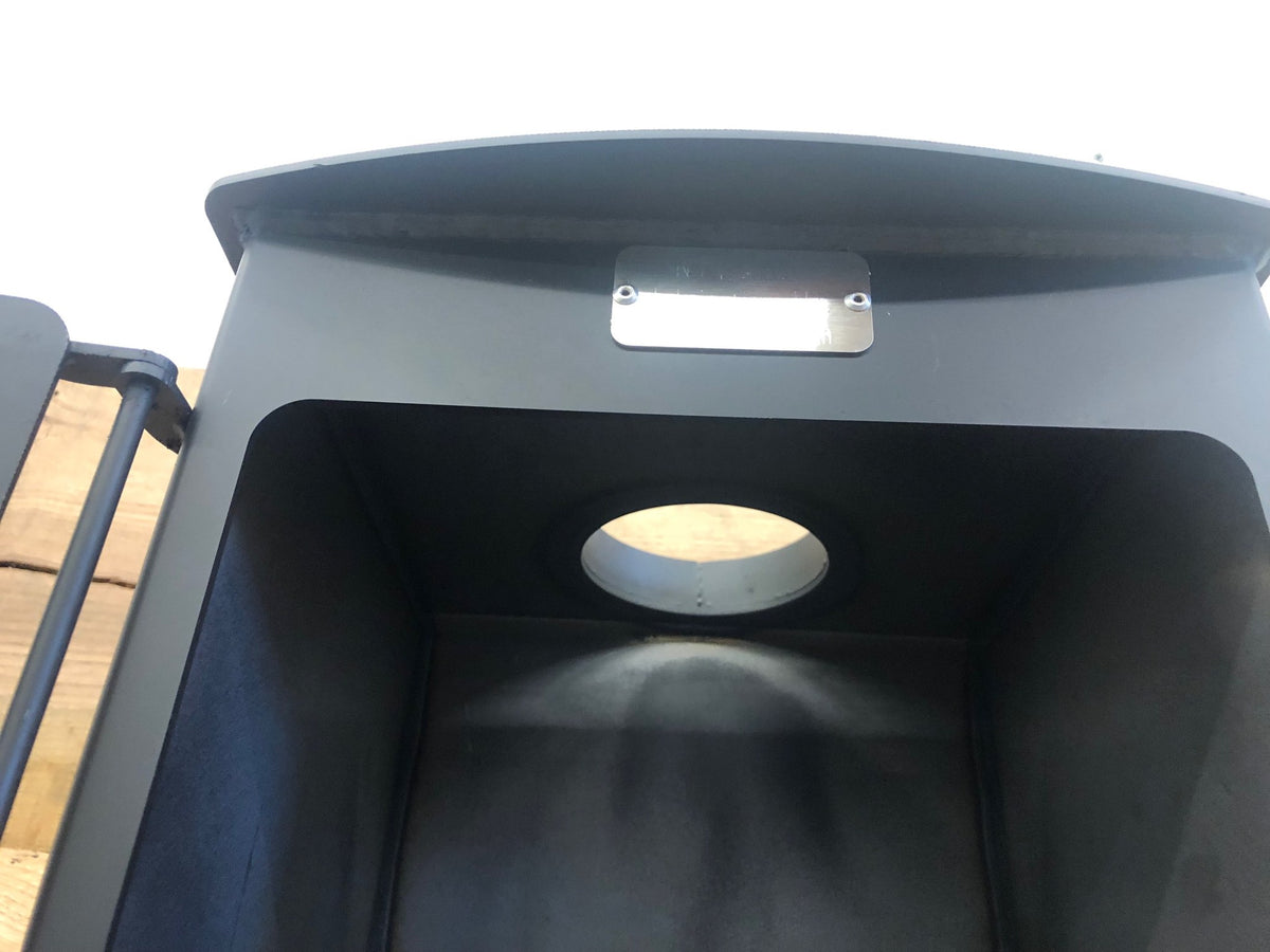 Mini Woodsman Wood Stove by North Woods Fabrication, flue collar seen from inside the firebox