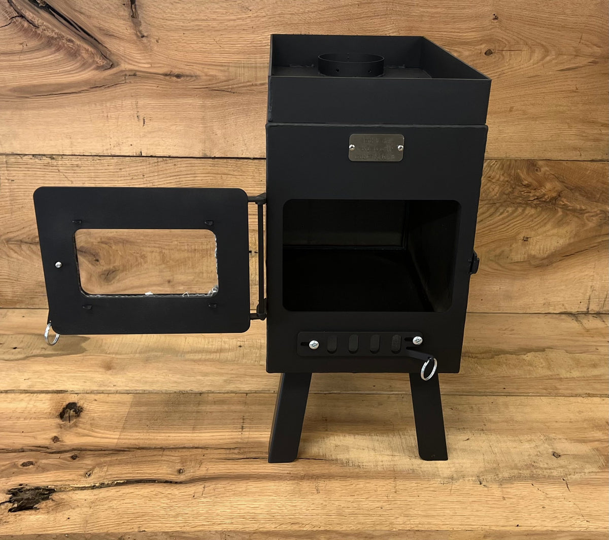 Sauna Wood Stove by North Woods Fabrication, door open to the firebox