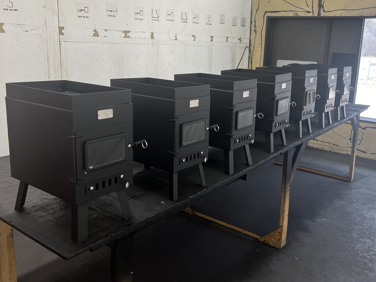 Sauna Wood Stove by North Woods Fabrication, a row of sauna stoves in the North Woods shop