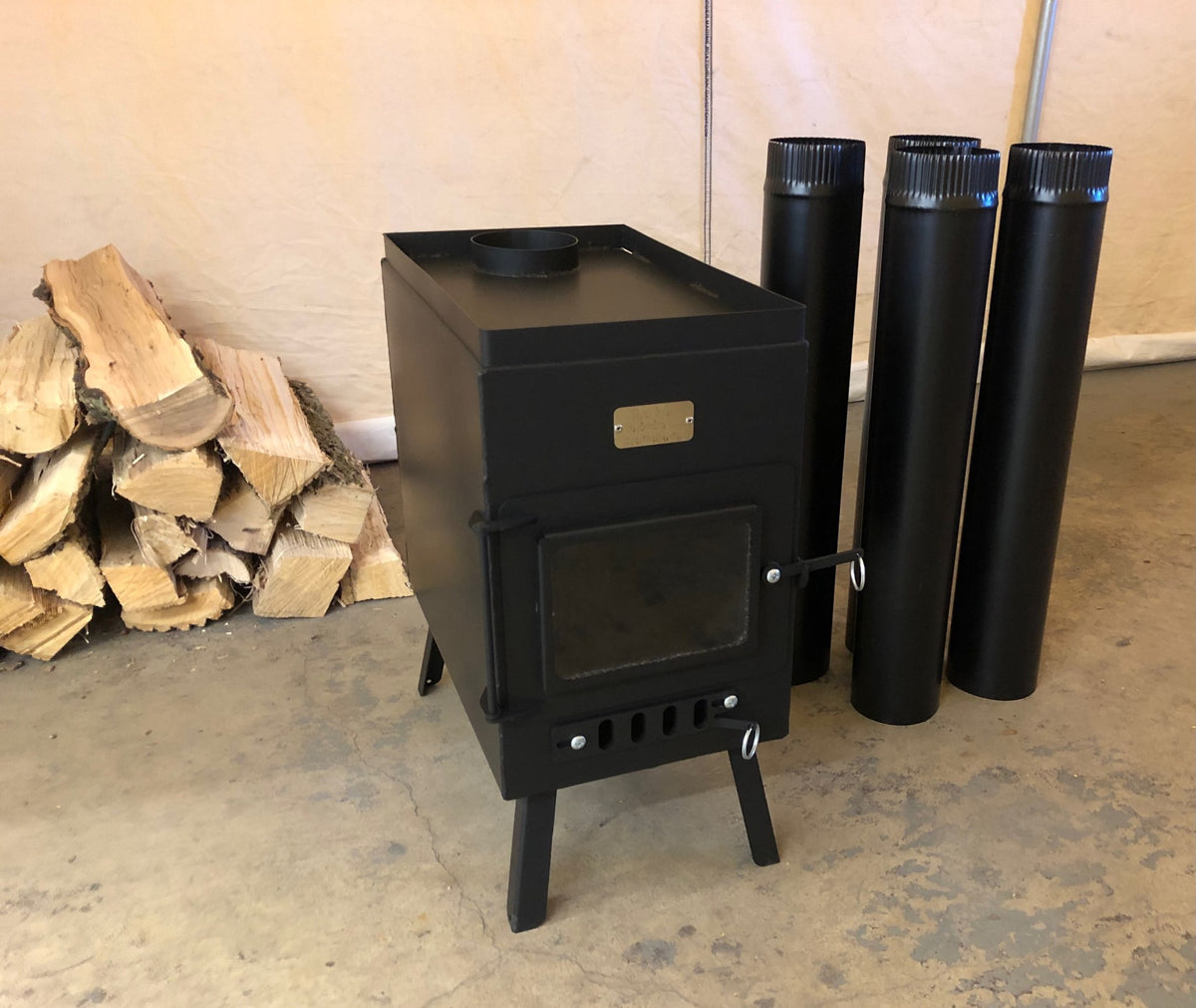 Sauna Wood Stove Kit by North Woods Fabrication, side view with stove pipe
