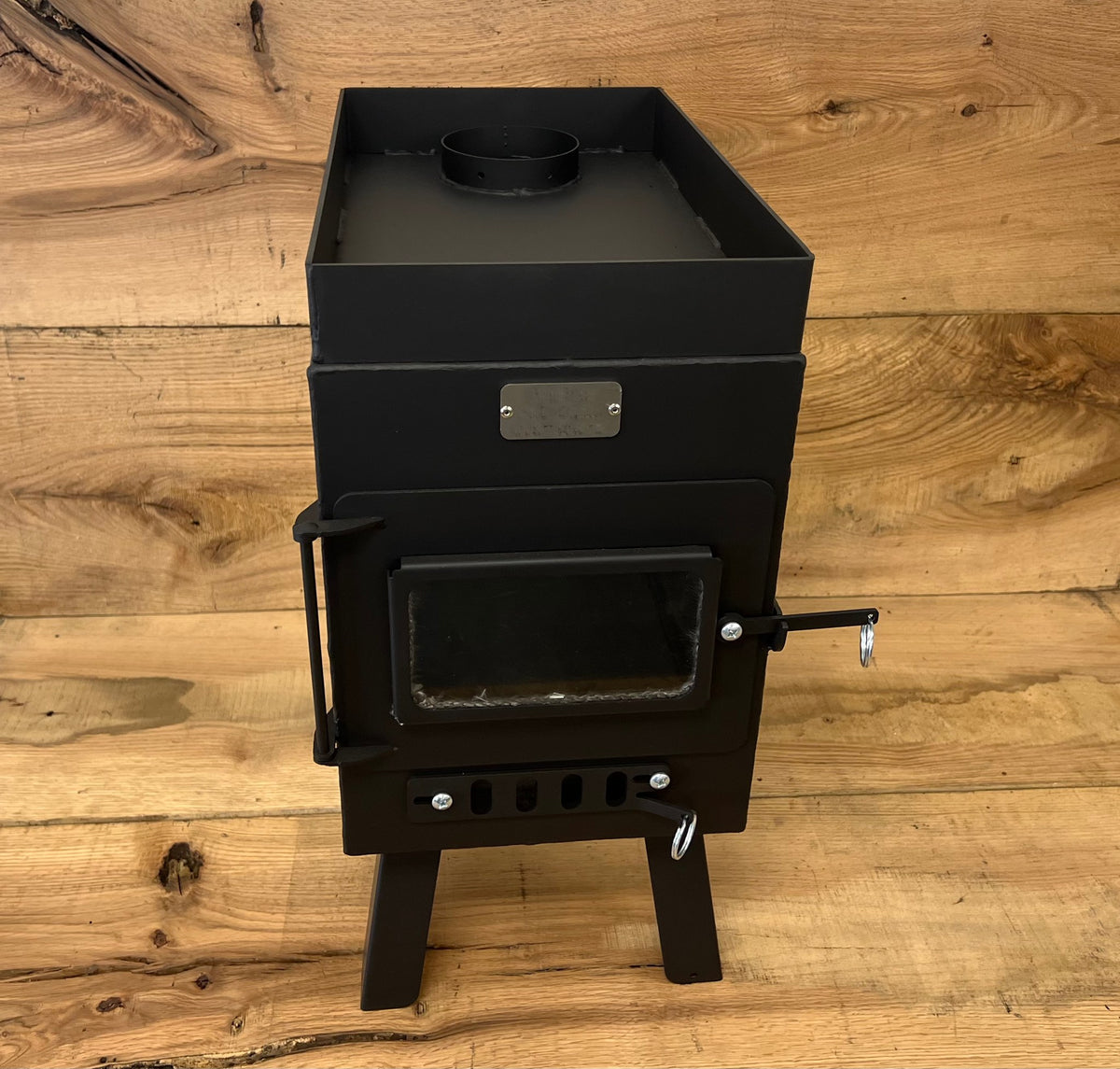 Sauna Wood Stove Kit by North Woods Fabrication, front view showing the rock lip