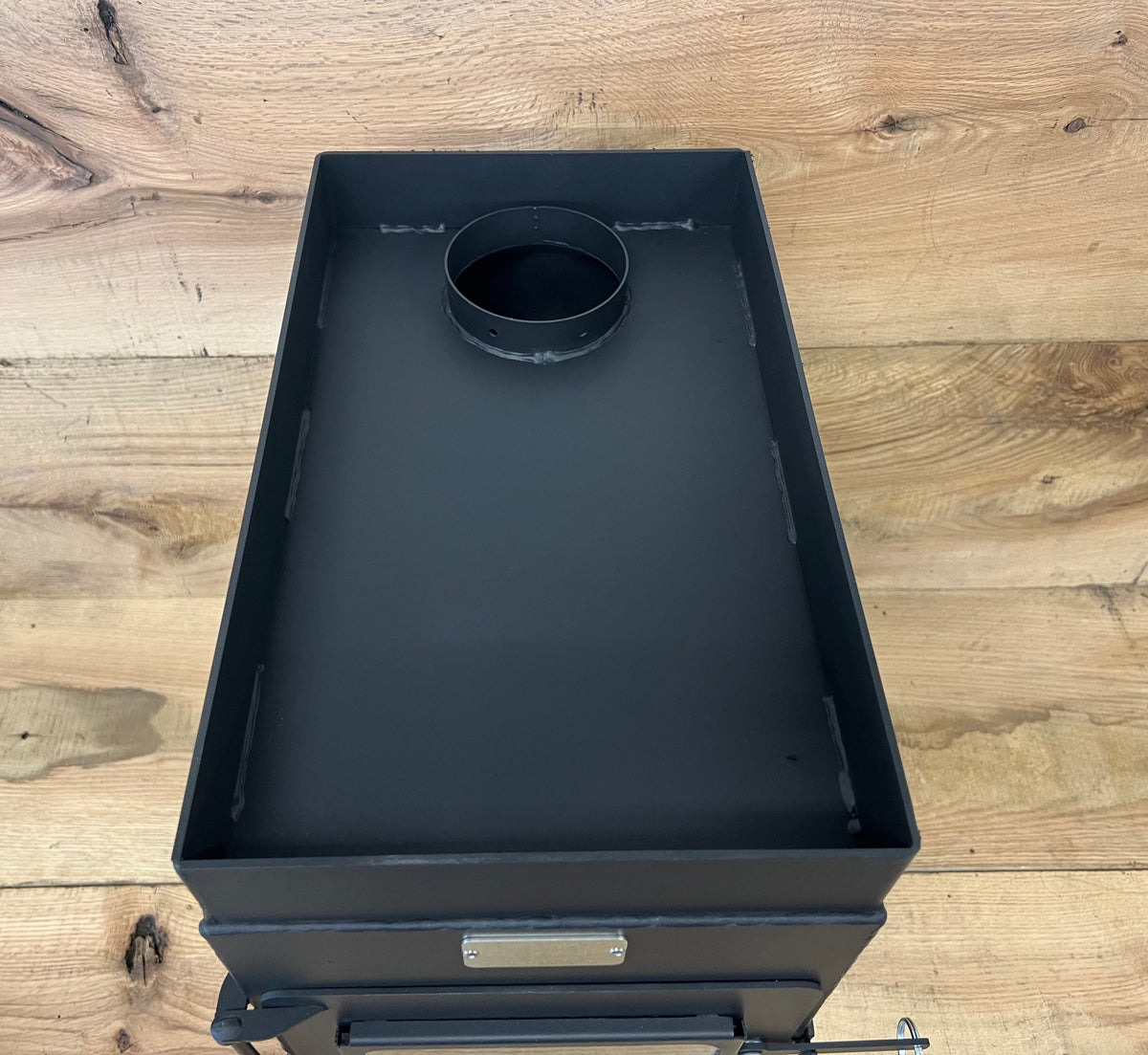 Sauna Wood Stove Kit by North Woods Fabrication, rock tray and flue collar from above