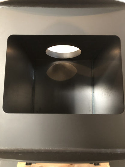 Woodsman Wood Stove by North Woods Fabrication, flue collar seen from inside the firebox
