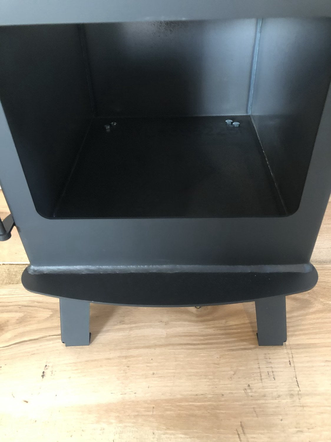 Woodsman Wood Stove by North Woods Fabrication, inside the firebox