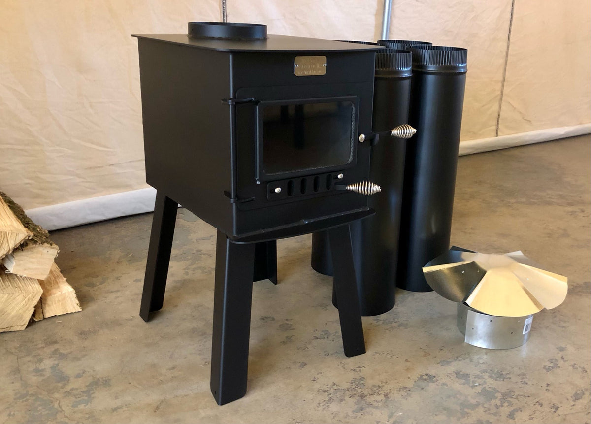 Woodsman Stove Kit by North Woods Fabrication, three-quarter view with stove pipe and rain cap