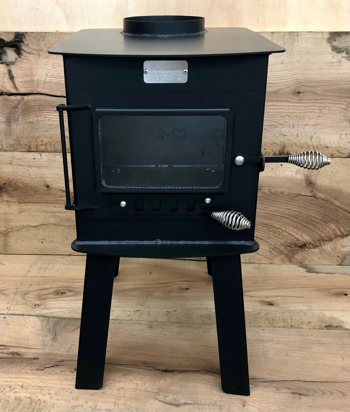Woodsman Stove Kit by North Woods Fabrication, front view with glass door