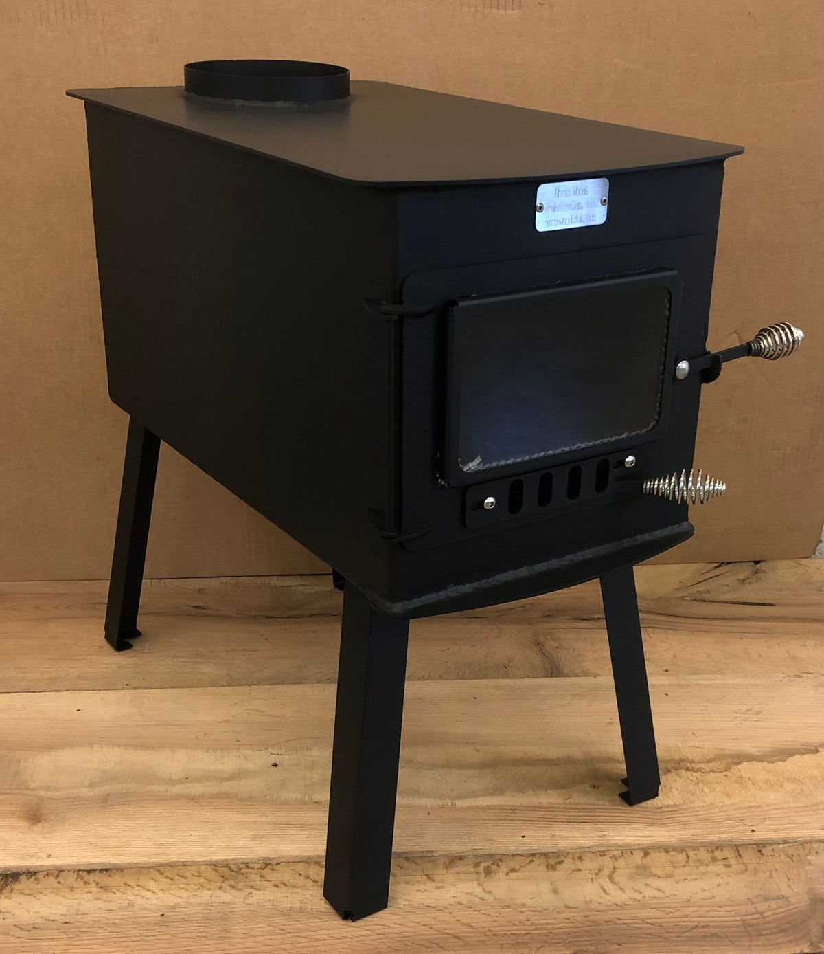 Woodsman XL Wood Stove by North Woods Fabrication, three-quarter view from the right
