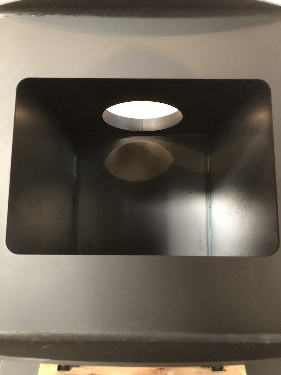Woodsman XL Wood Stove by North Woods Fabrication, flue collar seen from inside the firebox