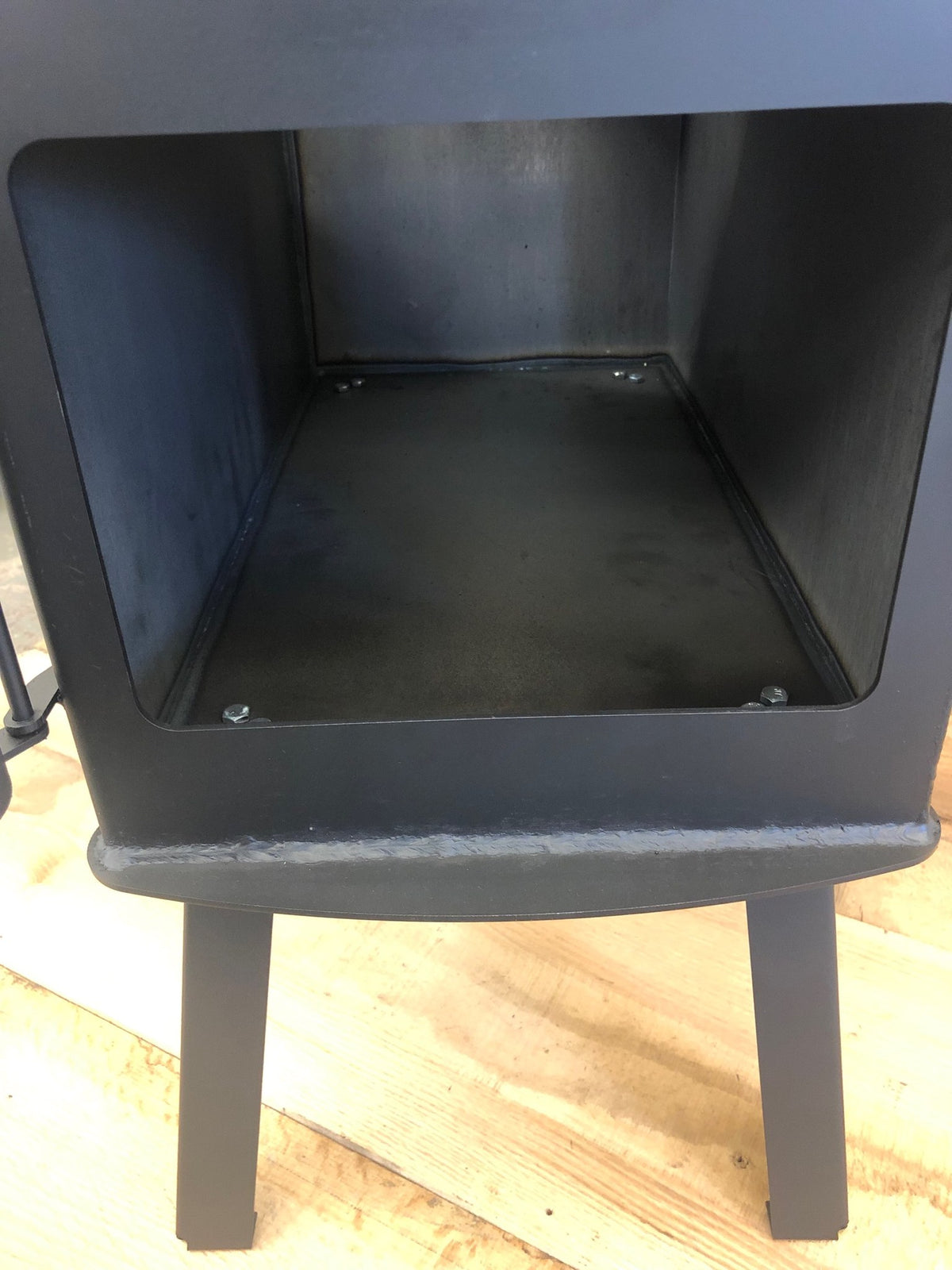 Woodsman XL Wood Stove by North Woods Fabrication, inside the firebox