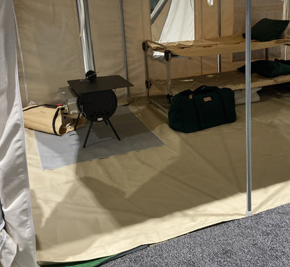 Stove Mat under a wood stove on a wall tent floor