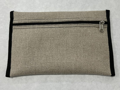 Flat canvas tackle pocket with a black zipper and black edge binding on a white surface.